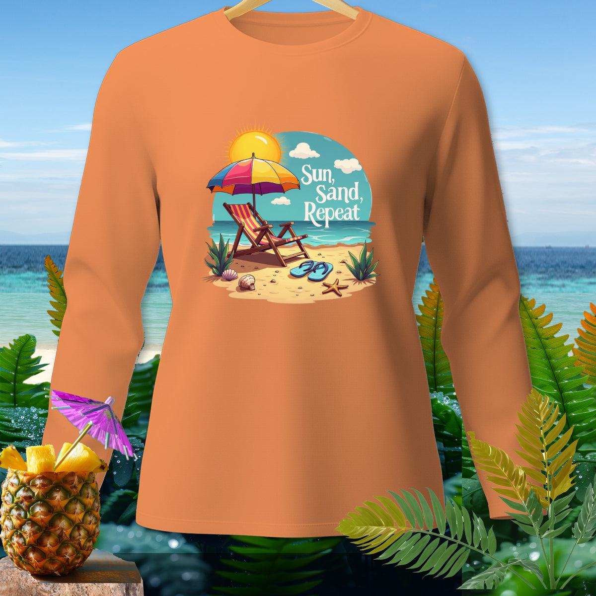 Orange long-sleeve shirt with a beach graphic and text "Sun, Sand, Repeat."