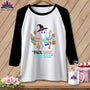 White raglan t-shirt with colorful octopus graphic and "Pack Light, They Said" text.