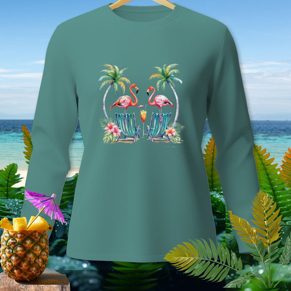 Teal long-sleeved shirt with two flamingos on beach chairs and a pineapple cocktail.