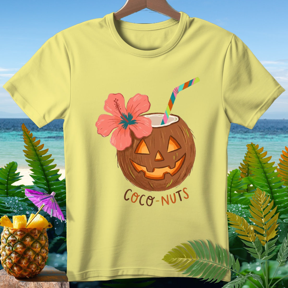 Yellow t-shirt with jack-o'-lantern coconut drink and "Coco-Nuts" text.
