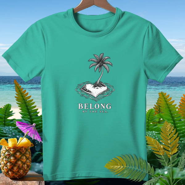 Teal t-shirt with heart-shaped island, palm tree, and "BELONG BY THE SEA" text.