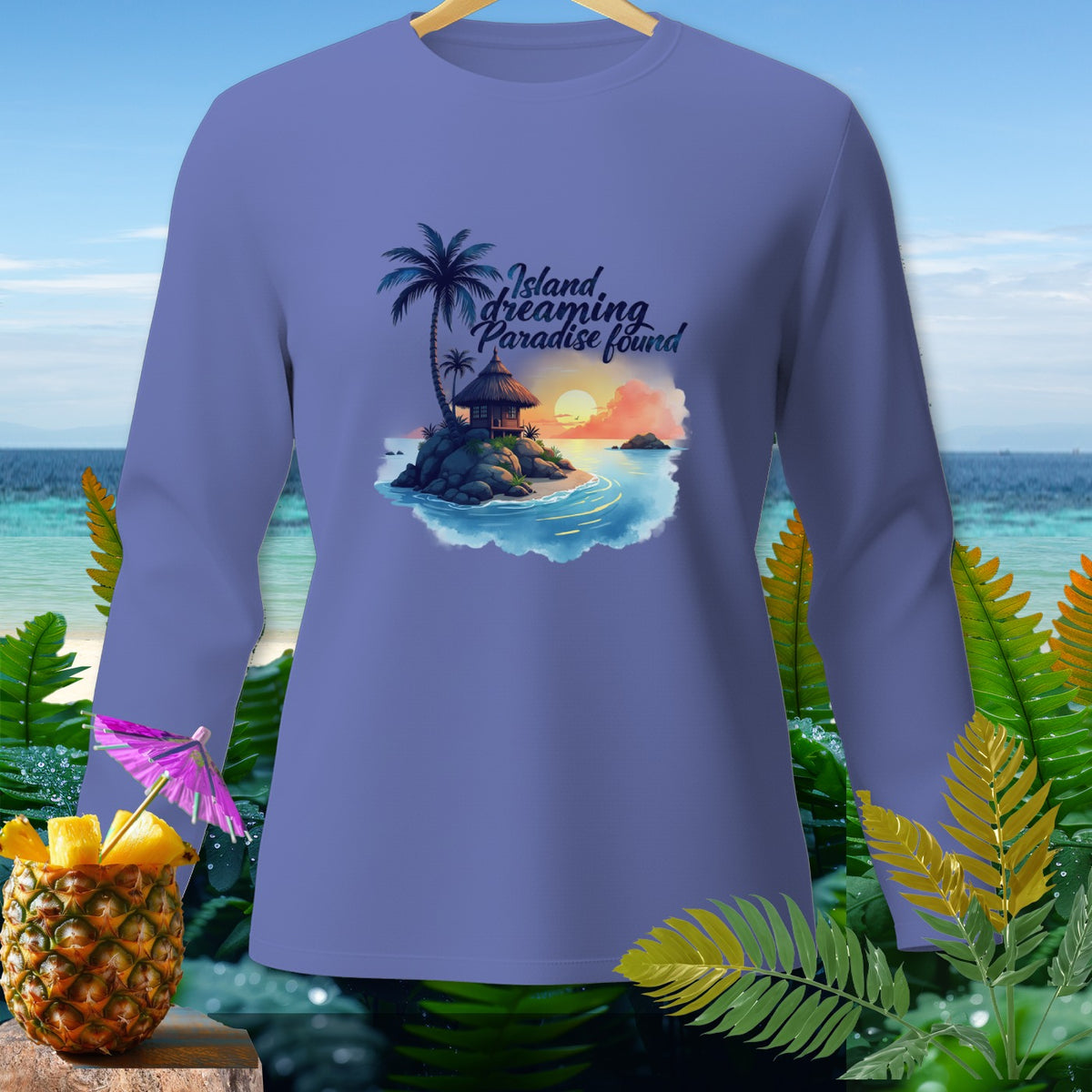 Purple long-sleeve shirt with "Island dreaming paradise found" text and tropical island graphic.