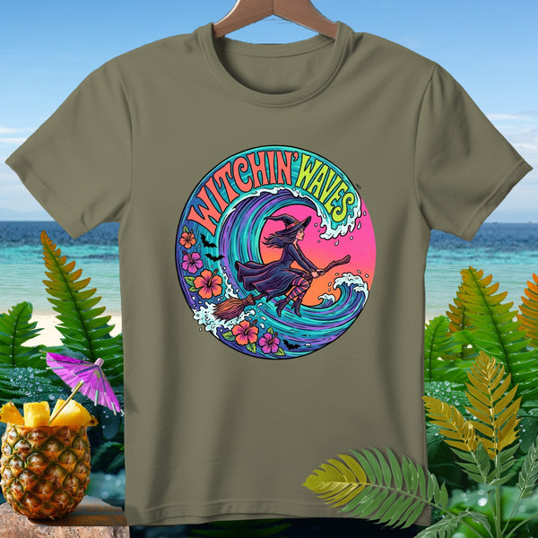 Olive green t-shirt with circular graphic of witch flying on broom over colorful wave and flowers.
