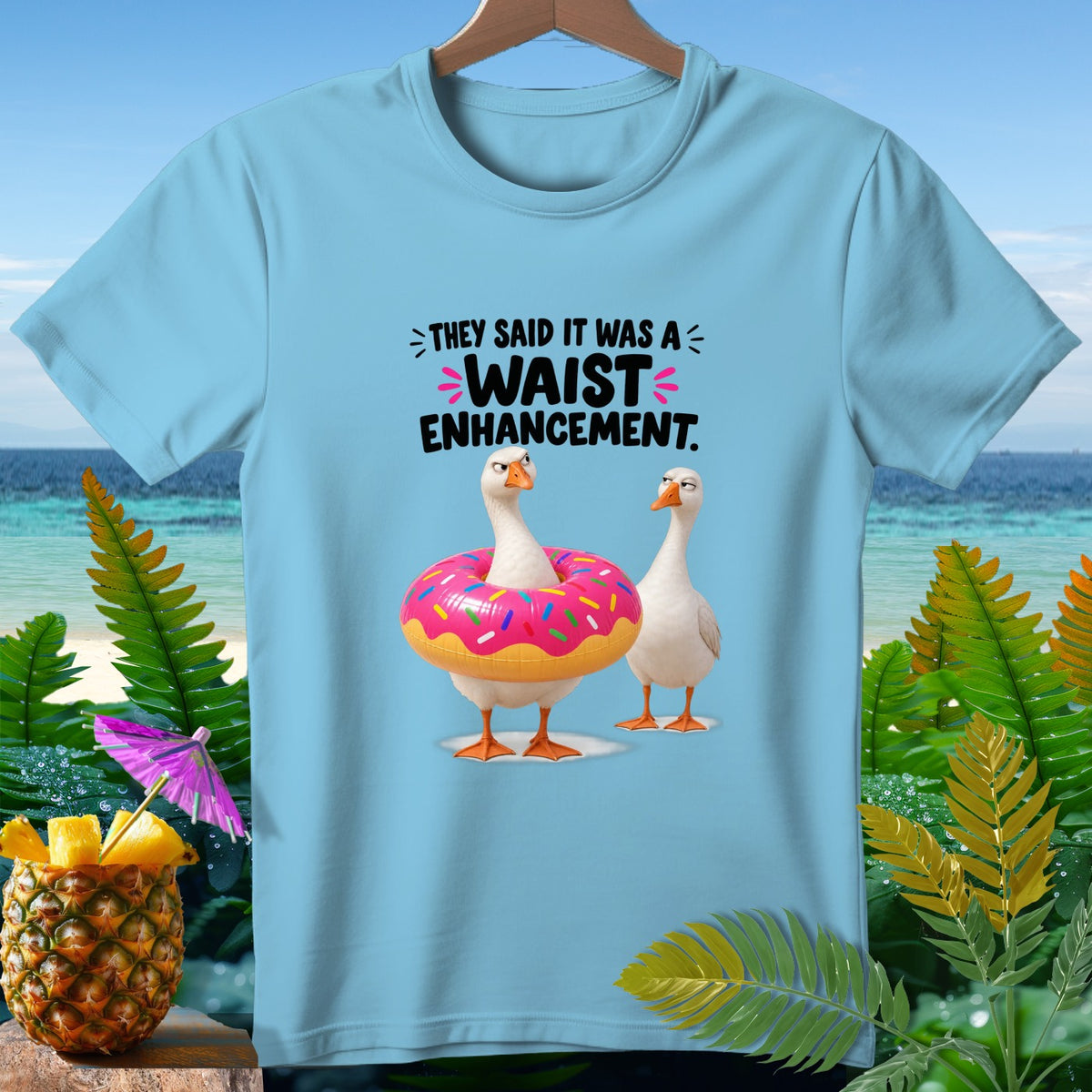 Light blue t-shirt with two geese, one wearing a donut float, and text "They said it was a waist enhancement."
