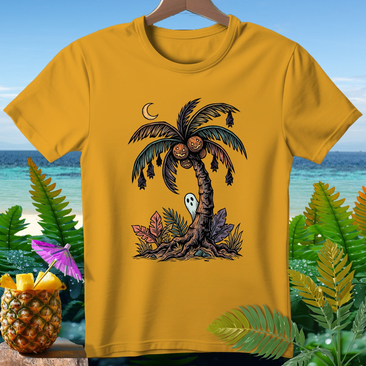 Yellow t-shirt with a Halloween palm tree graphic, ghost, bats, and jack-o'-lanterns.