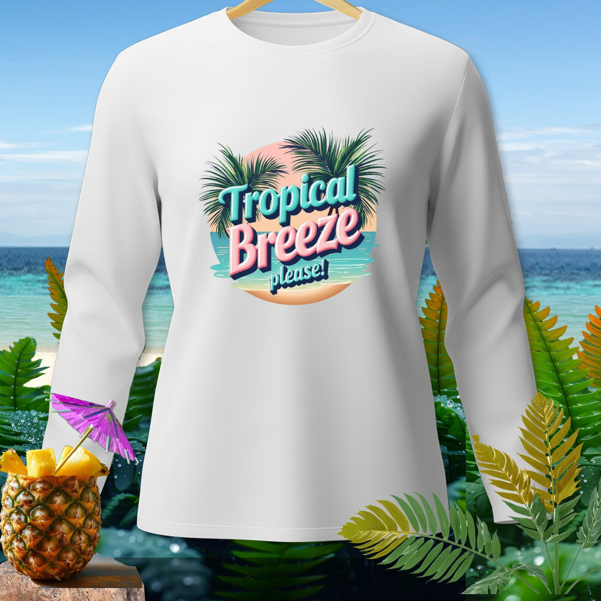 White long-sleeve shirt with "Tropical Breeze please!" graphic and tropical background.