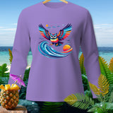 Purple long-sleeved shirt with colorful owl graphic over a wave and beach scene.