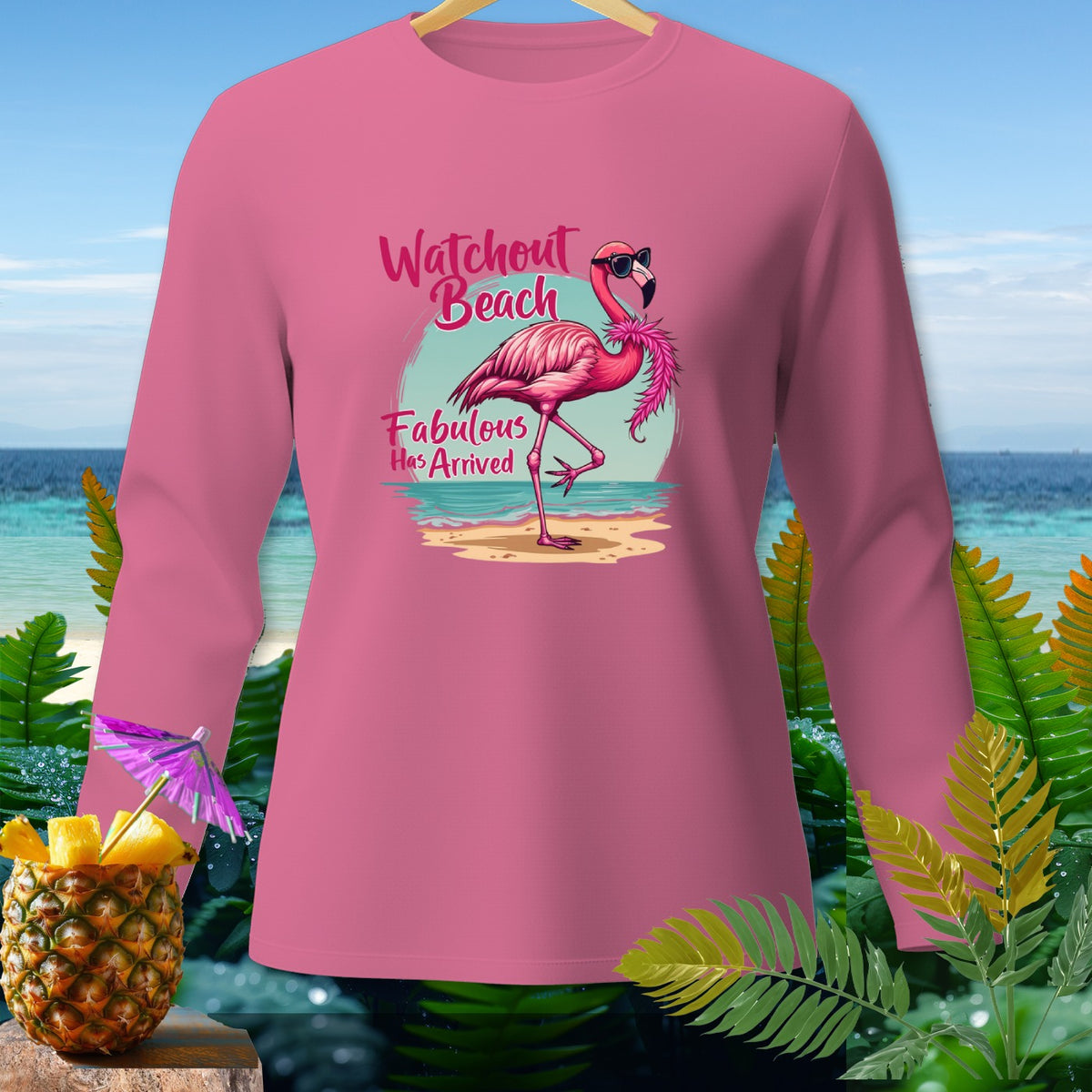 Pink long-sleeve shirt with a flamingo graphic reading "Watchout Beach Fabulous Has Arrived".