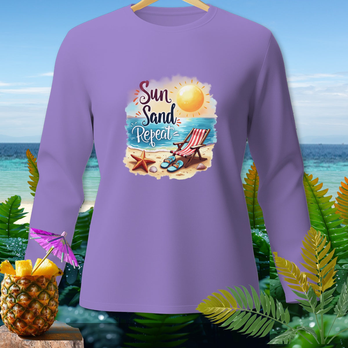Lavender long-sleeve shirt with "Sun Sand Repeat" beach graphic.