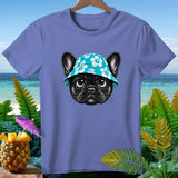 French bulldog wearing a floral bucket hat on a t-shirt with tropical background.