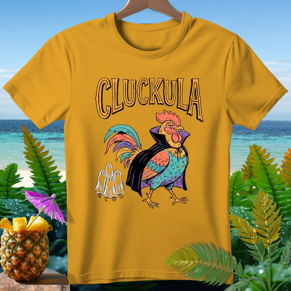 Yellow t-shirt with "Cluckula" text and a rooster in a cape with ghosts.