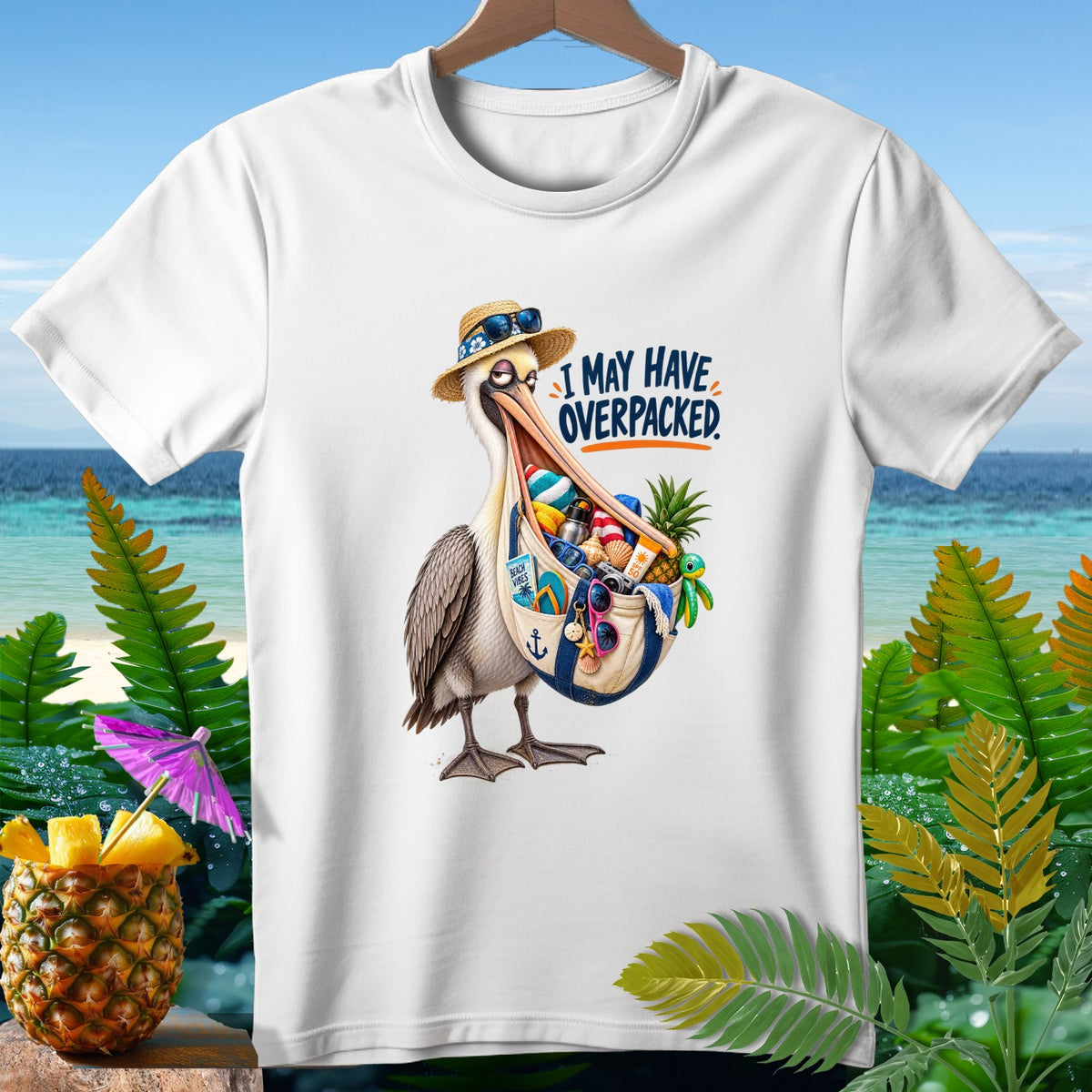 White t-shirt with a pelican illustration saying "I may have overpacked."