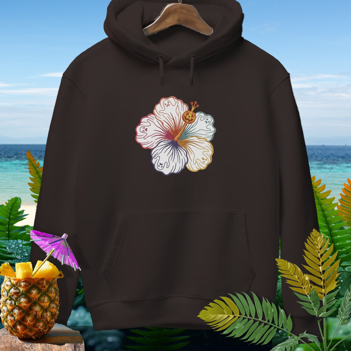 Brown hoodie with a colorful hibiscus flower graphic featuring ghosts and a jack-o'-lantern.