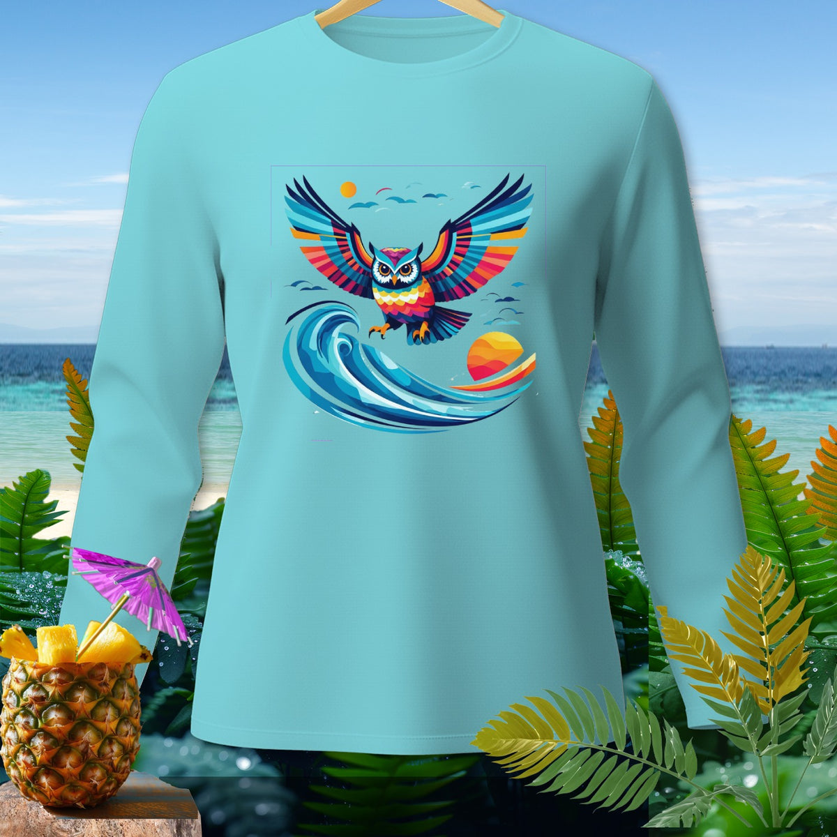 Light blue long-sleeve shirt with a colorful owl graphic and tropical background.