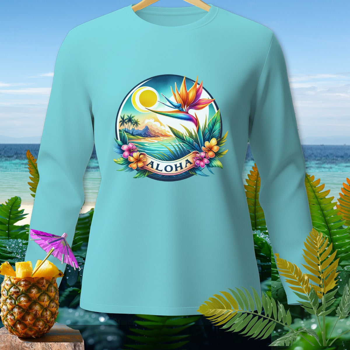 Light blue long-sleeved shirt with a tropical "ALOHA" graphic featuring a bird of paradise.