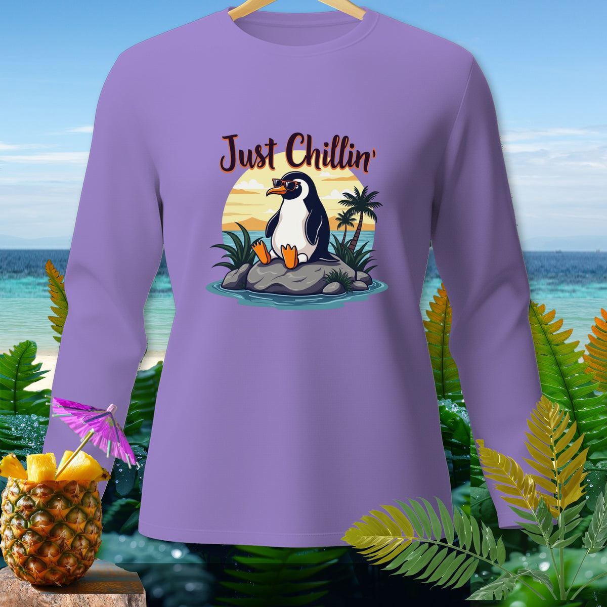 Purple long-sleeve shirt with a cartoon penguin saying "Just Chillin'"