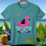 Black cat wearing witch hat on a pink flamingo float with moon and stars.
