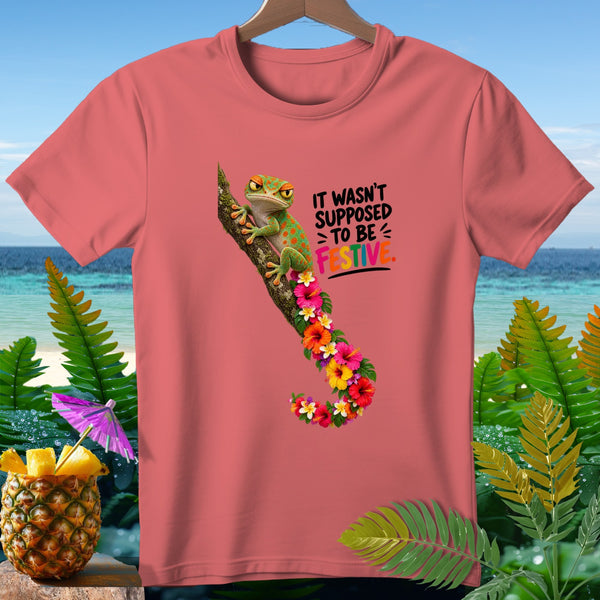Coral t-shirt with a gecko on a branch surrounded by hibiscus flowers and text.