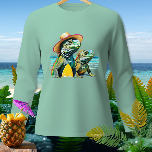 Two iguanas with hats, one with a surfboard, on a mint long-sleeve shirt.