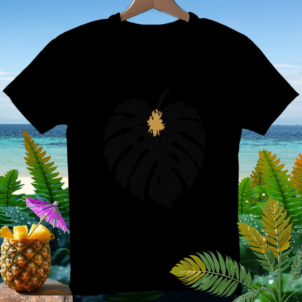Black t-shirt with a golden leaf outline on a tropical beach backdrop.