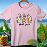 Pink t-shirt with three turtles drinking cocktails and the text 