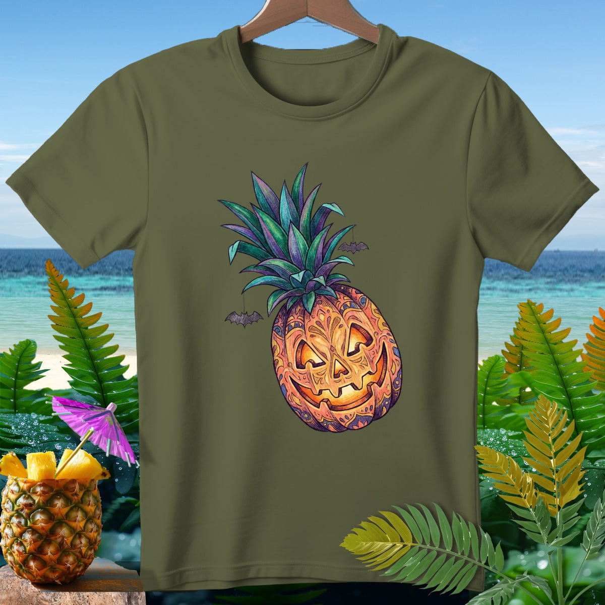 Green t-shirt with a carved pineapple jack-o'-lantern and bats graphic.