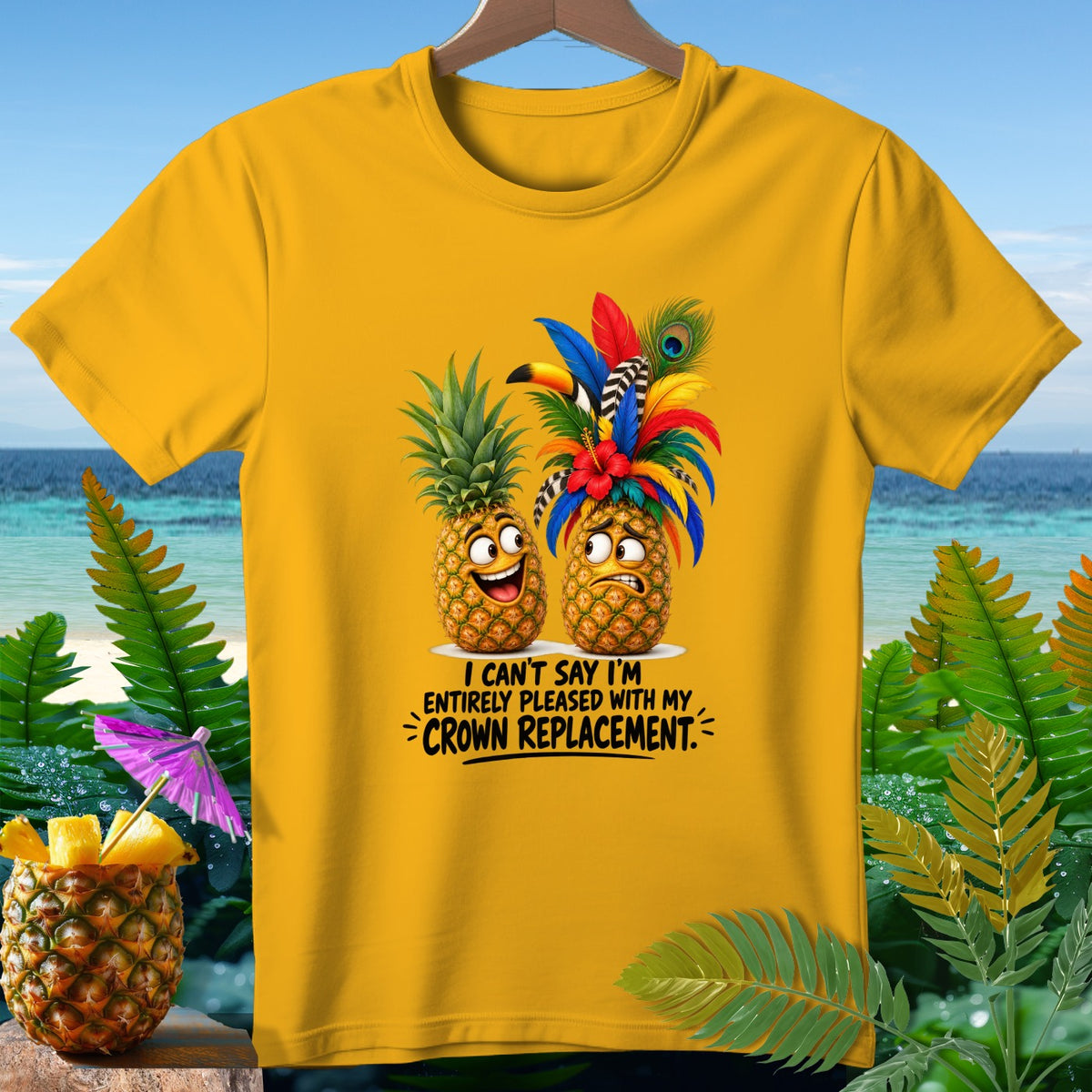 Yellow t-shirt with two cartoon pineapples, one happy, one sad, with text "CROWN REPLACEMENT."