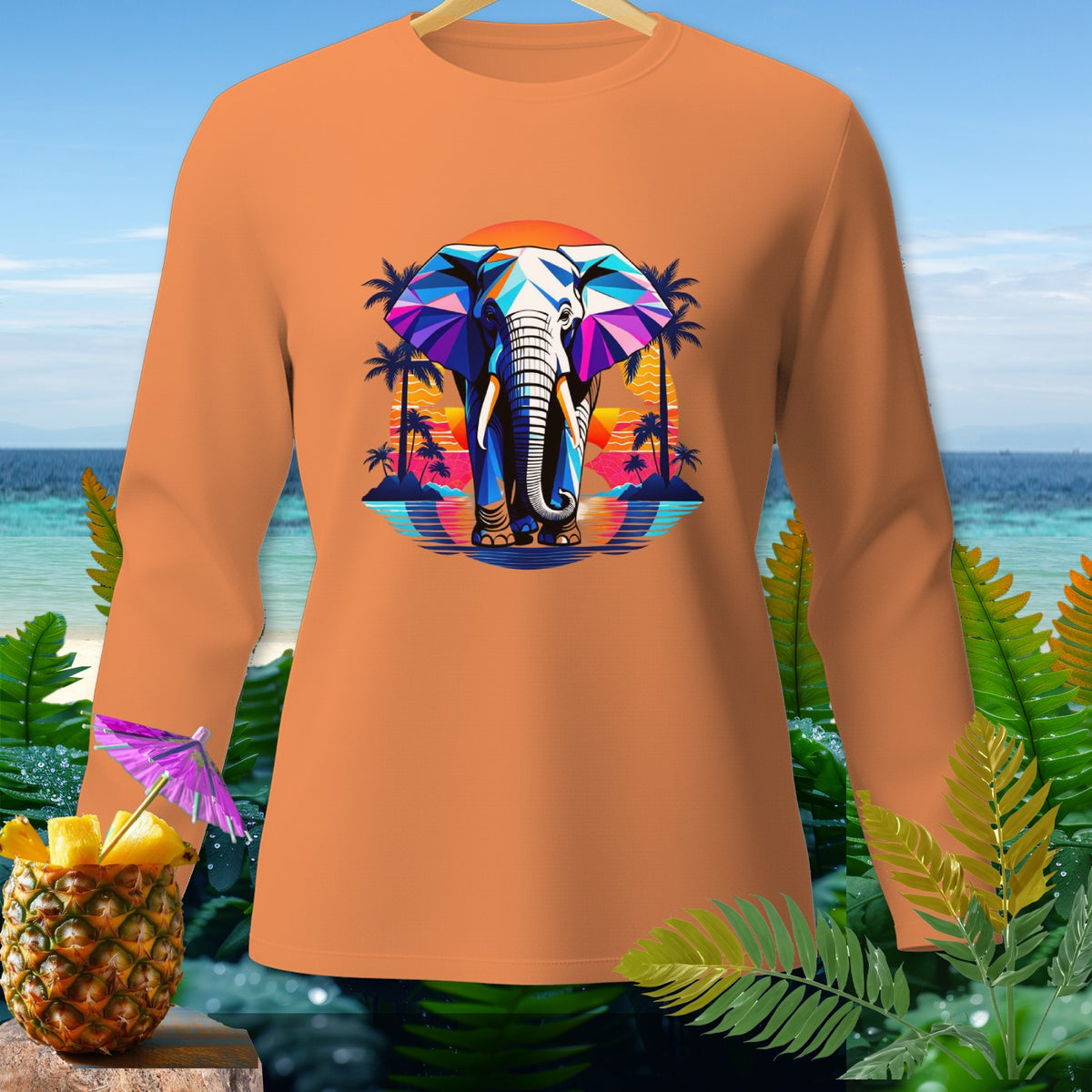Orange long-sleeve shirt with colorful geometric elephant graphic at sunset beach.