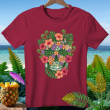 Burgundy t-shirt with a floral skull design, set against a tropical beach background.