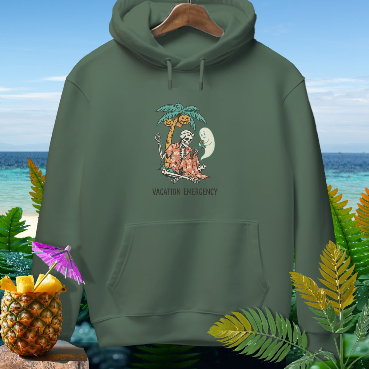 Green hoodie with skeleton graphic and "Vacation Emergency" text.