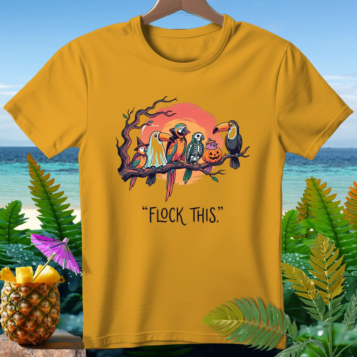 Yellow t-shirt with parrots dressed for Halloween and text "FLOCK THIS."