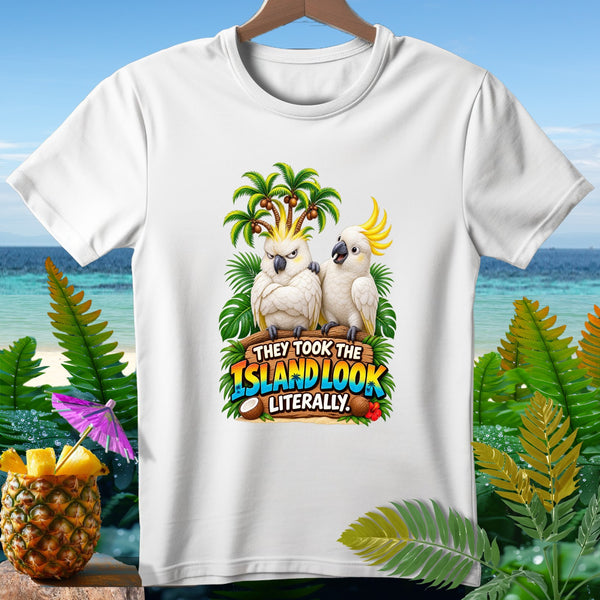 White t-shirt with two cockatoos and text "They took the island look literally".