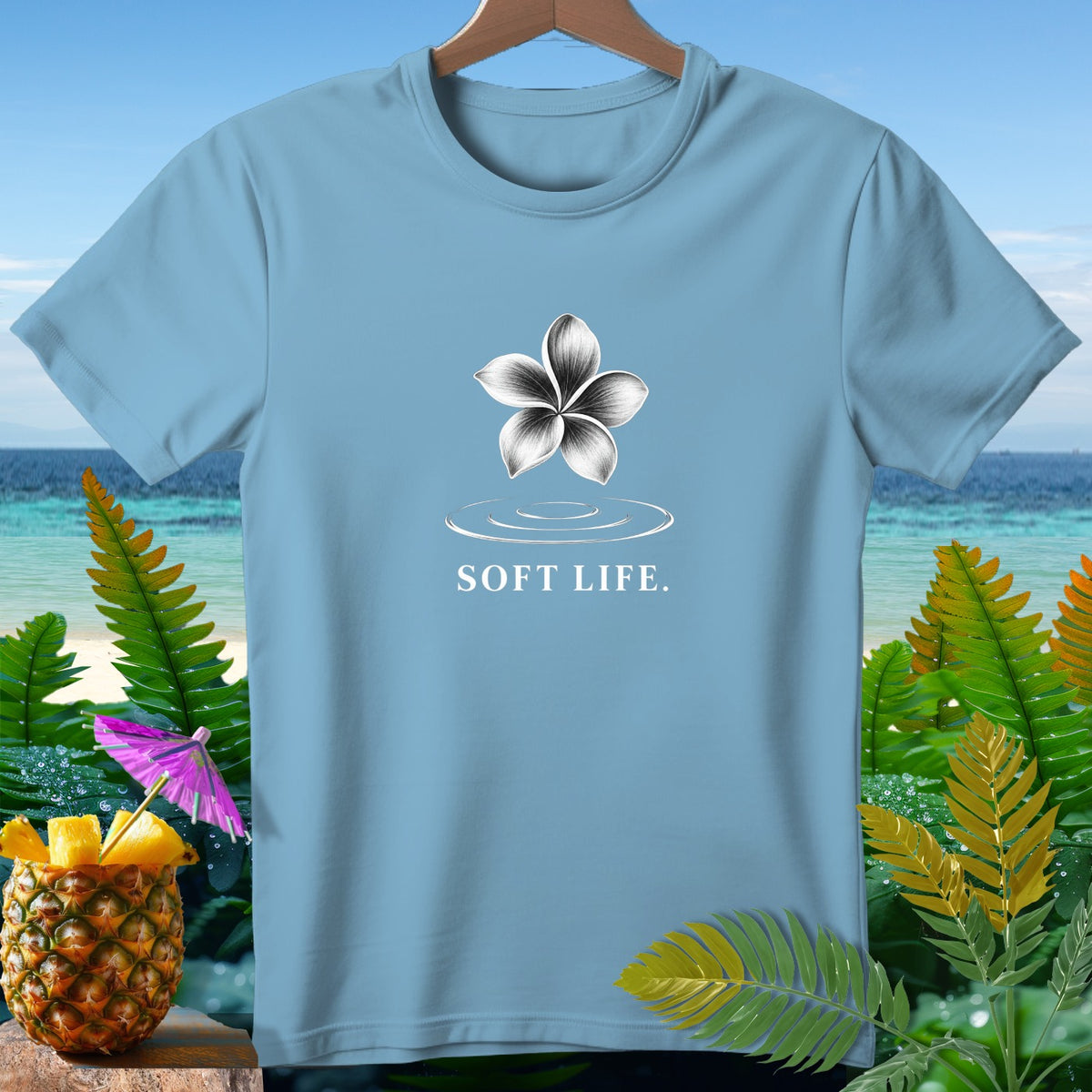 Light blue t-shirt with a floral design and "SOFT LIFE." text.