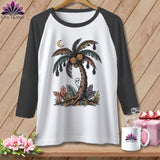 White t-shirt with graphic of a palm tree with pumpkins, bats, and a ghost.