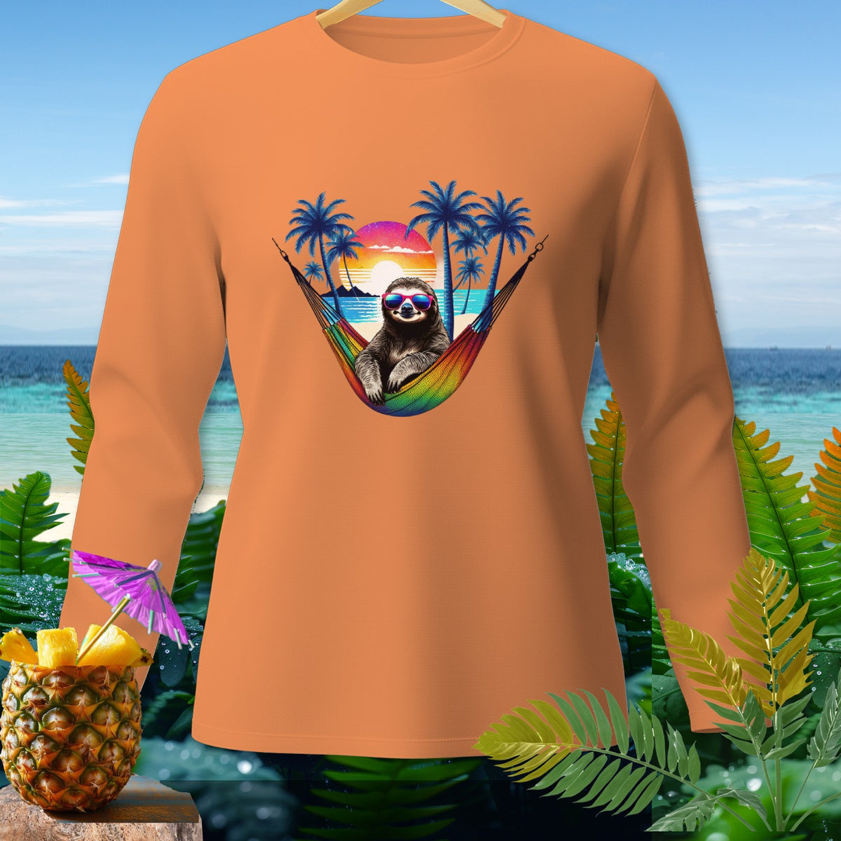 Orange long-sleeve shirt with sloth in hammock design, tropical sunset backdrop.