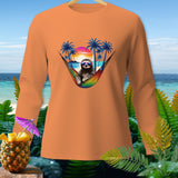 Orange long-sleeve shirt with sloth in hammock design, tropical sunset backdrop.
