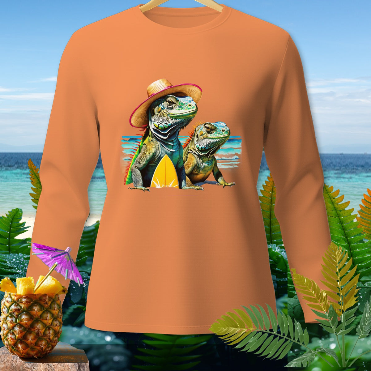 Orange long-sleeve shirt featuring two iguanas and a surfboard graphic with a tropical background.
