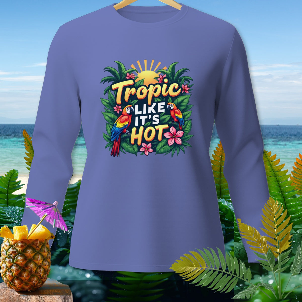 Purple long-sleeve shirt with "Tropic Like It's Hot" text and parrots design.
