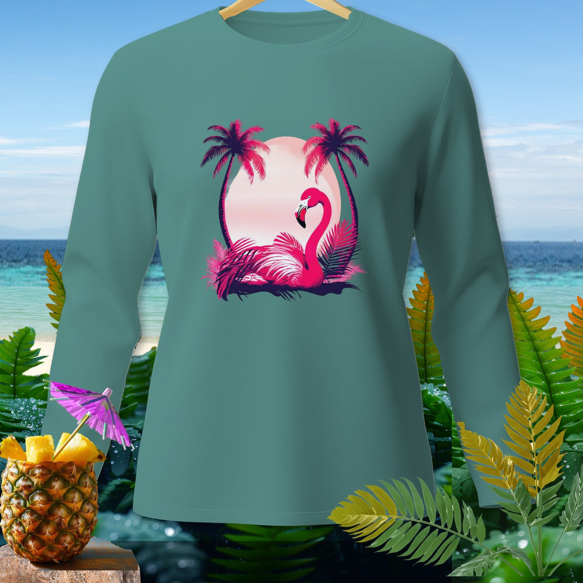 Teal long-sleeve shirt with flamingo, palm trees, and sunset graphic.