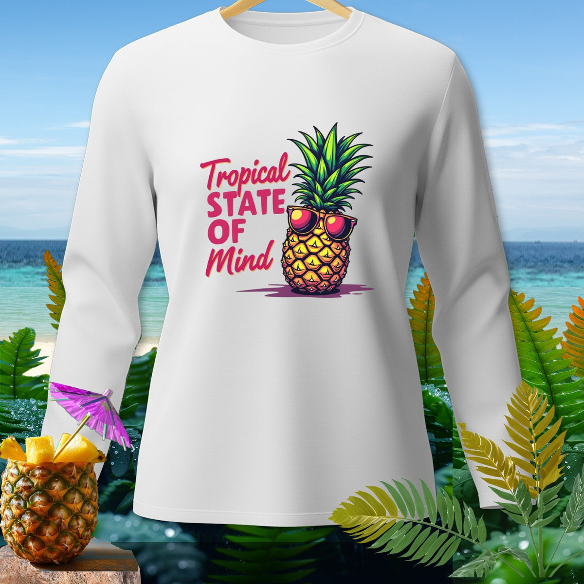 White long-sleeve shirt with "Tropical STATE OF Mind" text and sunglasses-wearing pineapple graphic.