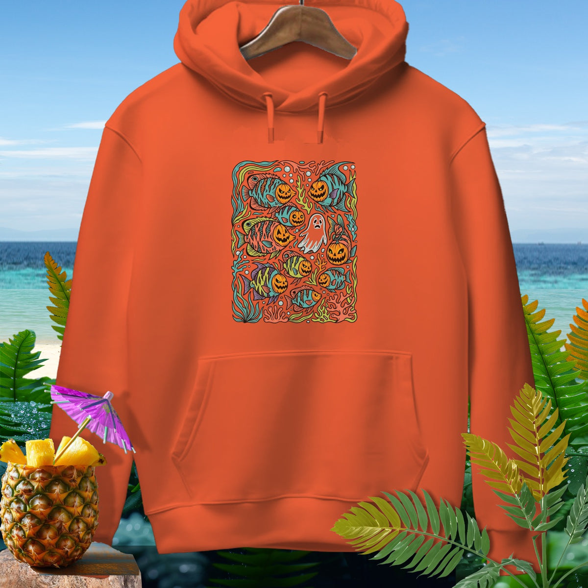 Orange hoodie with a Halloween-themed graphic featuring fish and pumpkins.