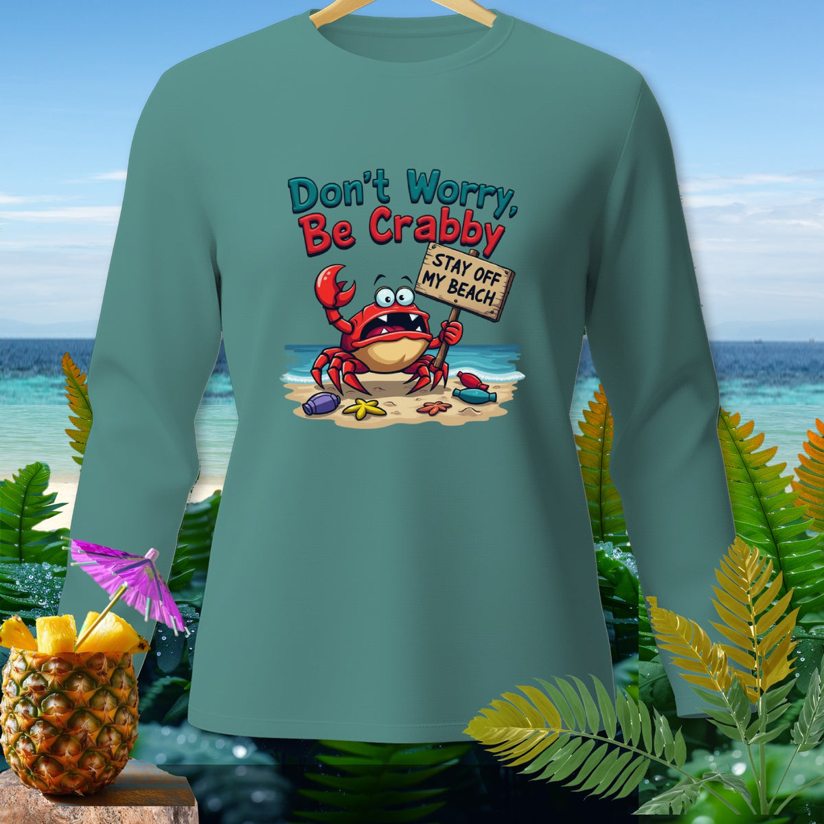 Green long-sleeve shirt with a crab graphic saying "Don't Worry, Be Crabby. Stay Off My Beach."