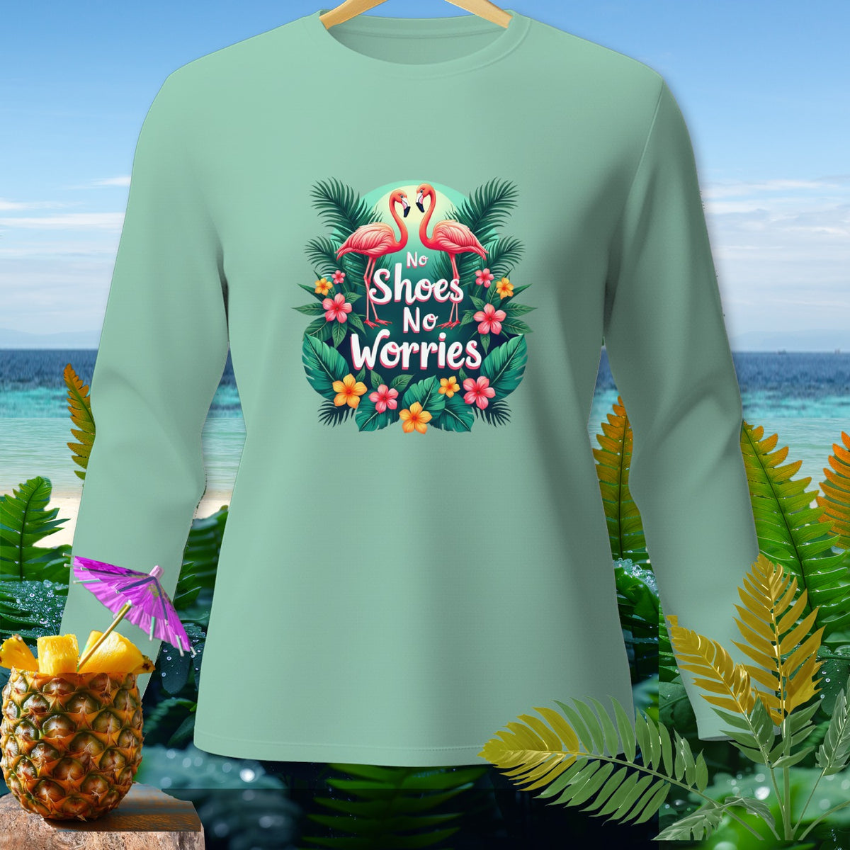 Mint long-sleeve shirt with flamingos and "No Shoes No Worries" text.