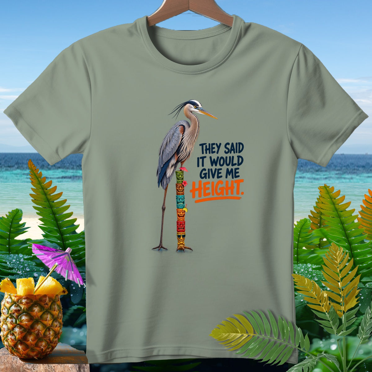 Great blue heron standing on a stacked tiki pole with text that says "They Said It Would Give Me Height."