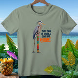 Great blue heron standing on a stacked tiki pole with text that says 