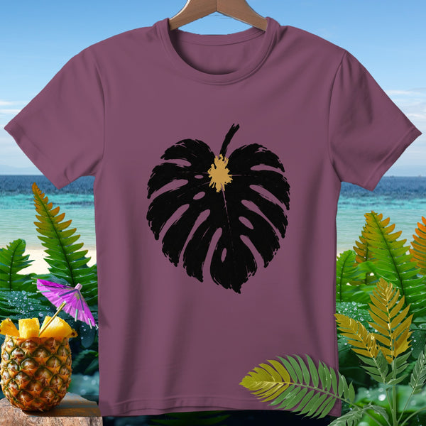 Plum t-shirt with a black monstera leaf graphic and tropical background.