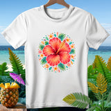 White t-shirt with a floral hibiscus design and tropical foliage background.
