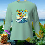 Mint long sleeve shirt with a cartoon sunflower surfing on a wave.