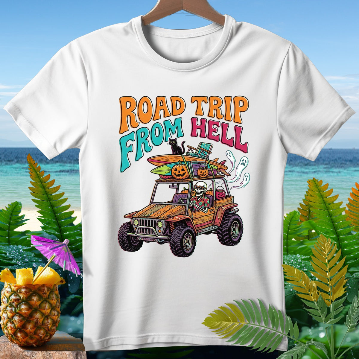White t-shirt with graphic "Road Trip From Hell" featuring skeletons in a jeep.