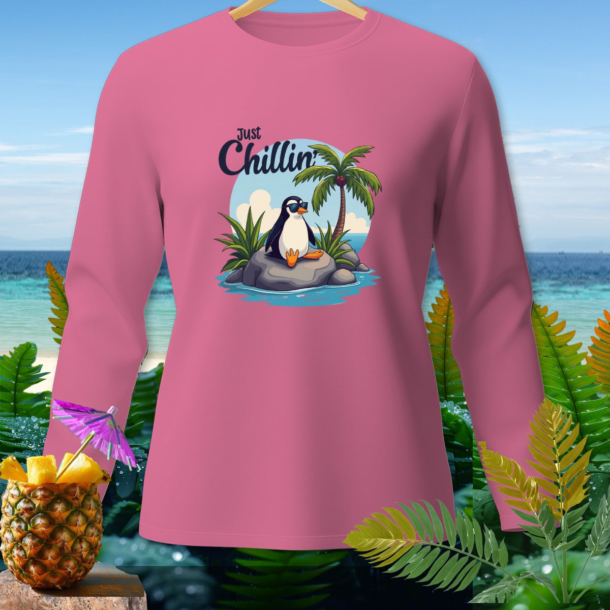 Pink long-sleeve shirt with "Just Chillin" text and a penguin on a rock.